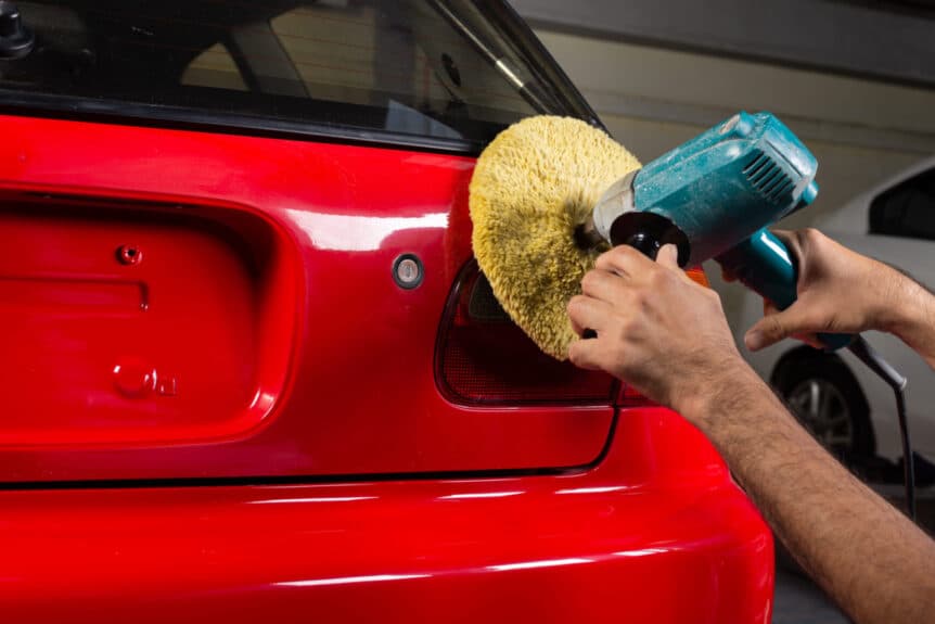Buffing and polishing red car to a perfect shine